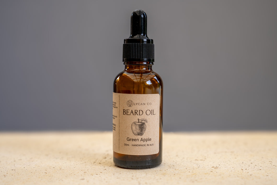 Green Apple LycanCo Beard Oil in a brown glass bottle, showcasing its fresh and crisp fragrance